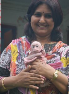 Renu Singh, Director of Lucknow Zoo, holding a newborn Bonnet Monkey at the zoo. The Bonnet Monkey is an endangered species, which is now being bred at the Lucknow Zoo. (Credit: Vikas Babu\WFS)