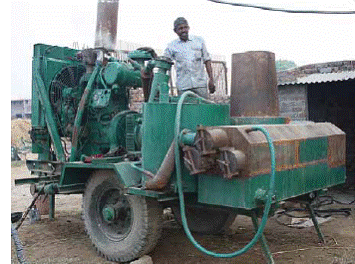 Raj Dahiya with Biomass Gasifier