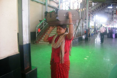 Parasai Sahu, 36, works as a woman porter at the Raipur station in Chhattisgarh.