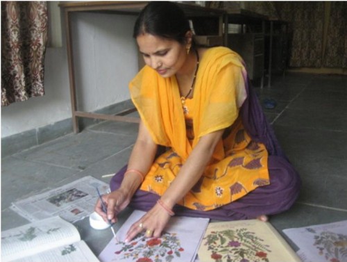 Uma Joshi, 35, of Naugaon village can make an incredible 150 file folders and picture hangings per month. (Credit: Nitin Jugran Bahuguna\WFS)