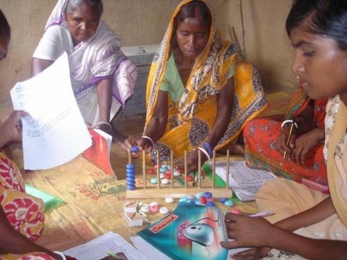 Women using various learning tools to educate themselves. (Credit: Pradan)