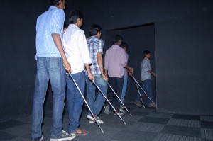 Visitors to the centre are given canes before entering to feel their way in the darkness