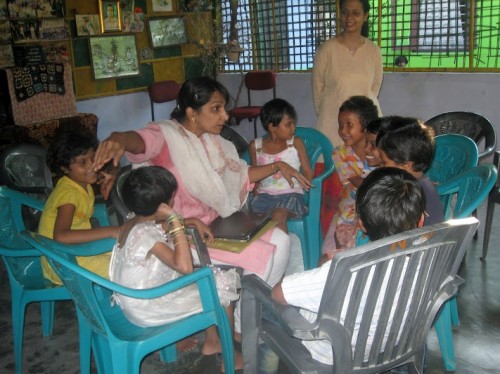 Meena (in the centre) telling the story to 20 kids at NabPrabhat Orphanage at Tezpur, Assam