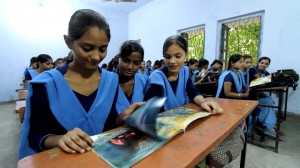 Children are excitedly flipping through their copies of the 'Be! Books' with their colourful pages filled with stories of entrepreneurship against all odds