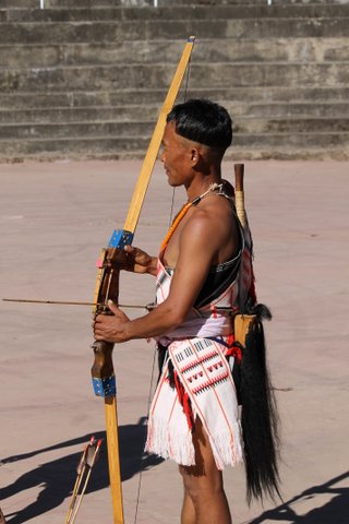 Naga tribesman in traditional attire competing in the archery contest.