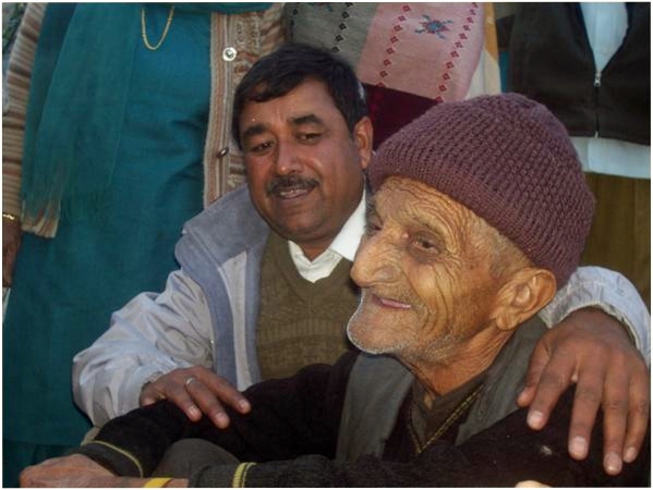 Mr Sharma with an elder in Old Age Home