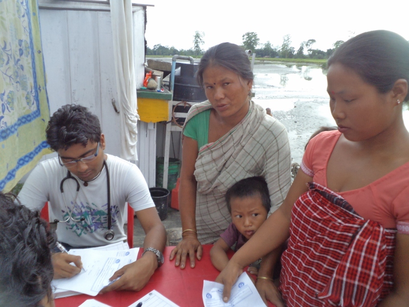 Women consult a doctor atop a boat clinic during one of its visits in Dhubri. (Credit: Azera Rahman\WFS)