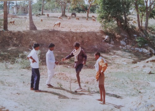 The villagers showing the lake bed which had been dry for many years.