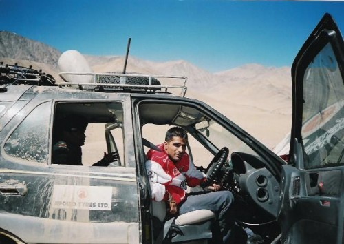 Gulia in the car he created history in and now, on his mission to feed children.