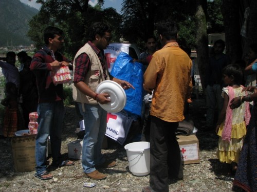 JayPrakash Panwar, a life member of Indian Red Cross Society distributing relief material to the families of Gyansu 