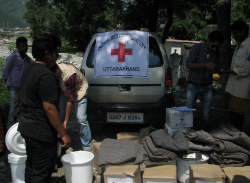 Relief material such as tents, tarpoline, blankets, kitchen utensils, stoves and buckets being distributed to the displaced people  of Gyansu