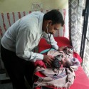Dr Jayakumar Reddy treating a newborn child