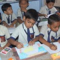 Children participating in an inter-school drawing competition at the school