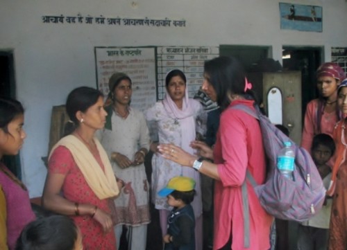 A mountaineer talking to the villagers of New Didasari giving them some hope and courage 