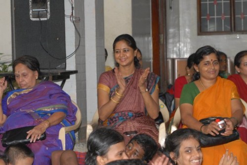 Dr. Vasudha Prakash (centre) enjoying the concert with the children