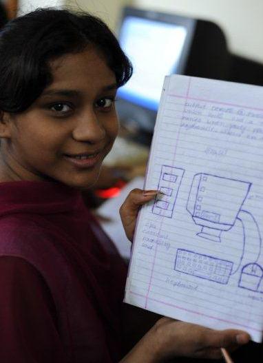 A rescued girl learning computer education with this NGO's help