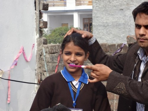 Basic tenets of personal health and hygiene are taught to the students from low income families