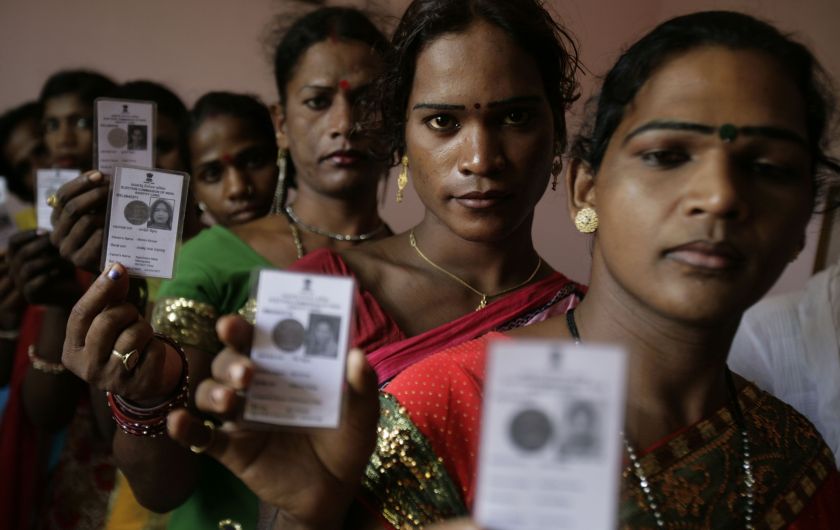 Image of transgender persons holding election cards