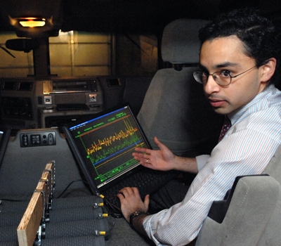 Shakeel Avadhany (Materials Science '09) monitors pressure, position, and generated power sensor data on the custom data acquisition system. Photo: Donna Coveney. 