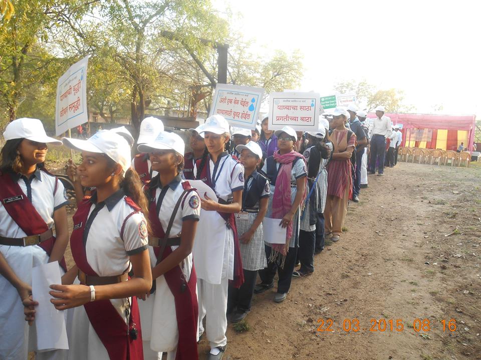 Girl students prepare for rally through town in Aurangabad - holding placards reading (rough translation)  "Saving(Increase) in Water is Increase in (society) Wealth" "(Good)Water supply is part of (our) Development"