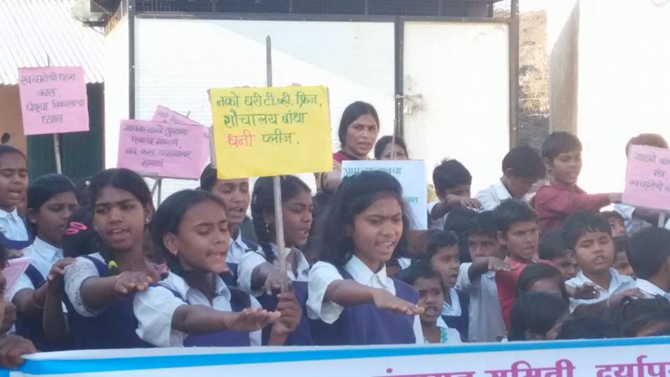 Placard (translation) "No TV & Fridge, first build Toilet please" in one of the many Vidyarthi rallies.