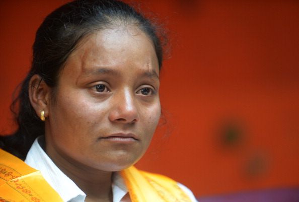 Indian mountaineer Arunima Sinha, who had her leg amputated below the left knee two years ago gestures during a press conference in Kathmandu on May 28, 2013. Twenty-six year old Sinha from the northern state of Uttar Pradesh, who lost her leg after she was thrown from a moving train two years ago, became the first female amputee to climb Everest on May 21. AFP PHOTO/ Prakash MATHEMA        (Photo credit should read PRAKASH MATHEMA/AFP/Getty Images)