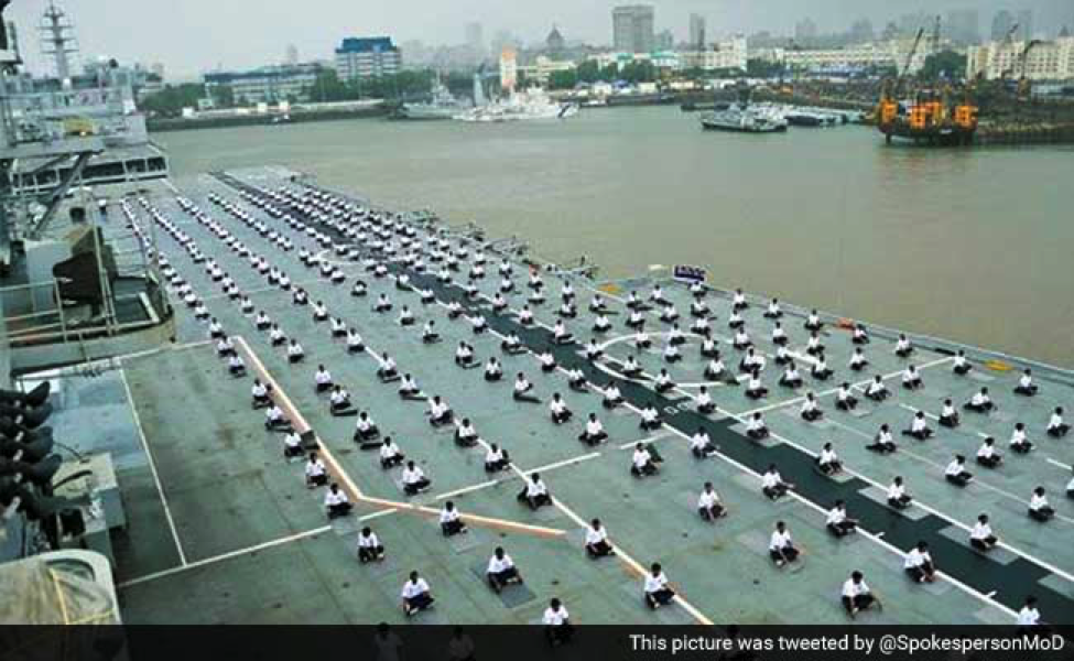 NAVY PERSONNEL PERFORMING YOGA ON THE DECK OF INS VIRAAT