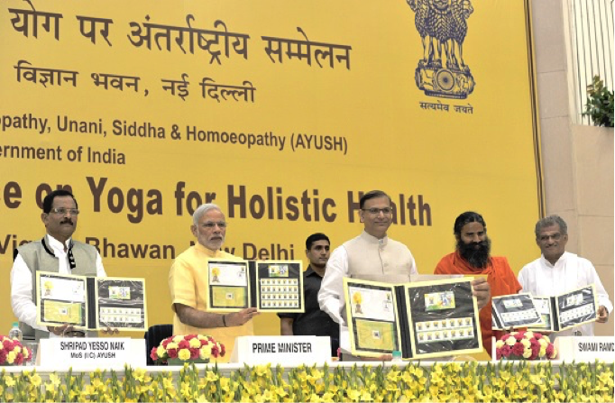 PRIME MINISTER NARENDRA MODI RELEASING THE FIRST DAY COVER, STAMP AND MINI SHEET ON INTERNATIONAL DAY OF YOGA AT THE VIGYAN BHAWAN ON 21 JUNE 2015