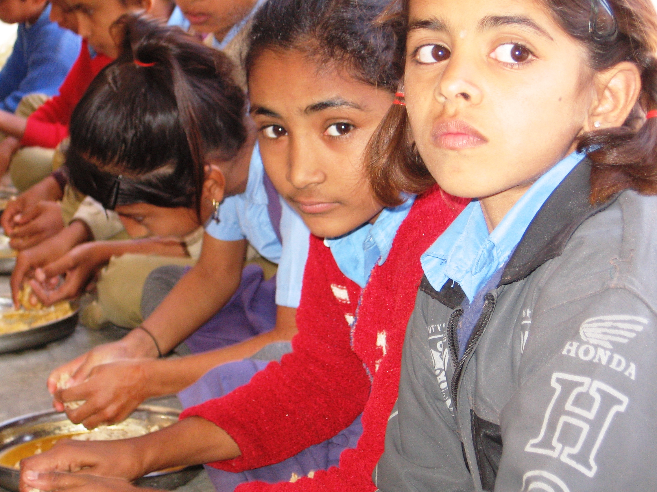 In Rajasthan, where child malnutrition is rampant, a special initiative is ensuring that these youngsters get their daily recommended quota of iron, folic acid and vitamins A and D through the mid day meals provided in state schools. (Credit: Abha Sharma/WFS)