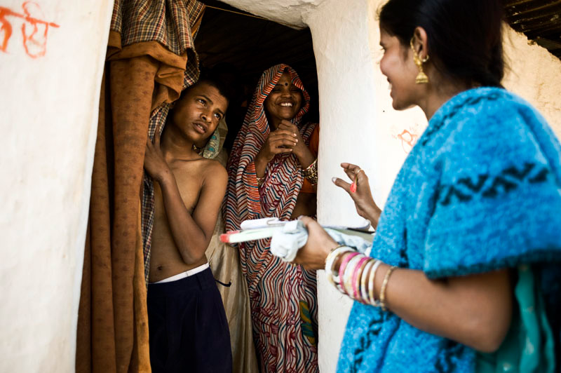Health workers go door to door to make sure patients take their dose on time.