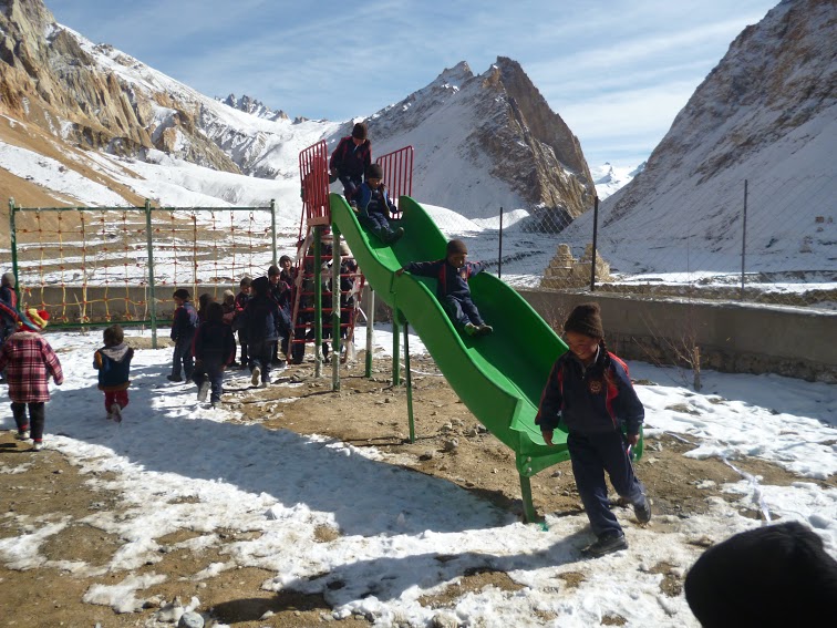 Middle School Kanji, last village before the Kargil border gets a playground which the team installed in the November. The snow does not stop the children from playing. altitude - 10211, No. of Children - 46