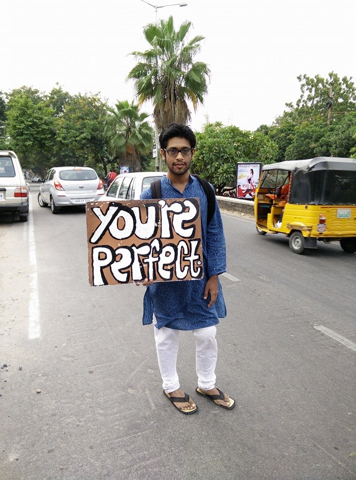 "I saw this guy today near Starbucks he is really awesome he was holding that sign for hours just to see smiles on people's faces," says Lohit Veda Vyas