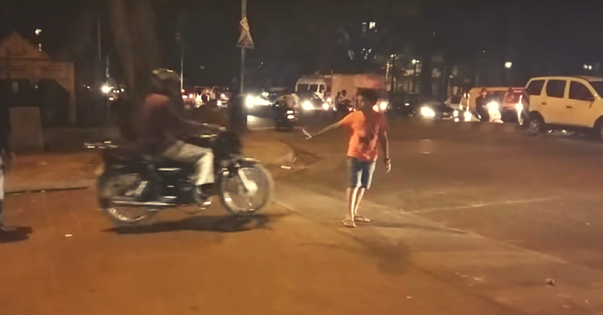 VIDEO: Move over Cops. Watch This Bangalore Kid Control Traffic Like a Pro!