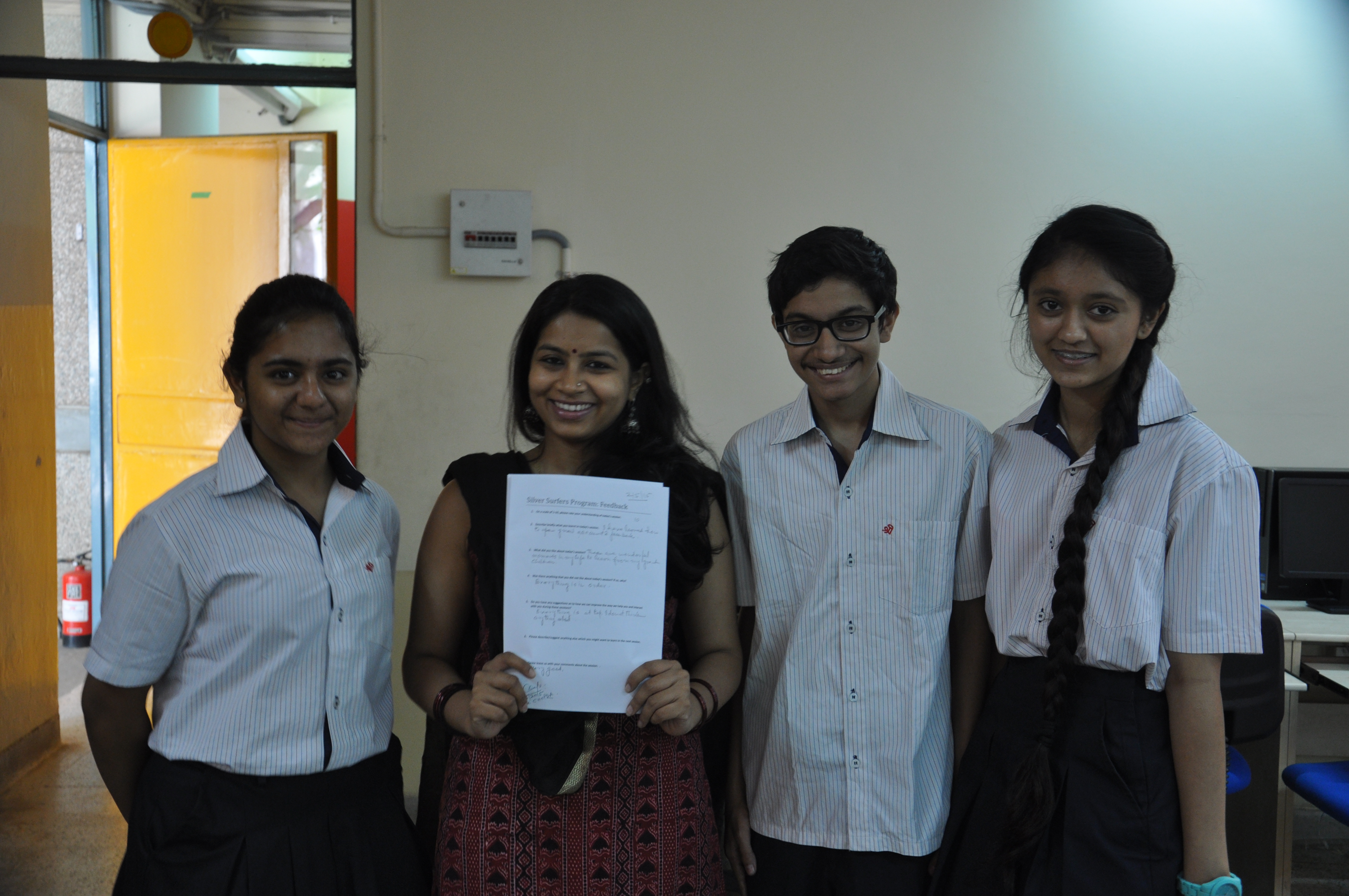 Suyesha (on extreme left) and Vibhor (second from right) with their teacher