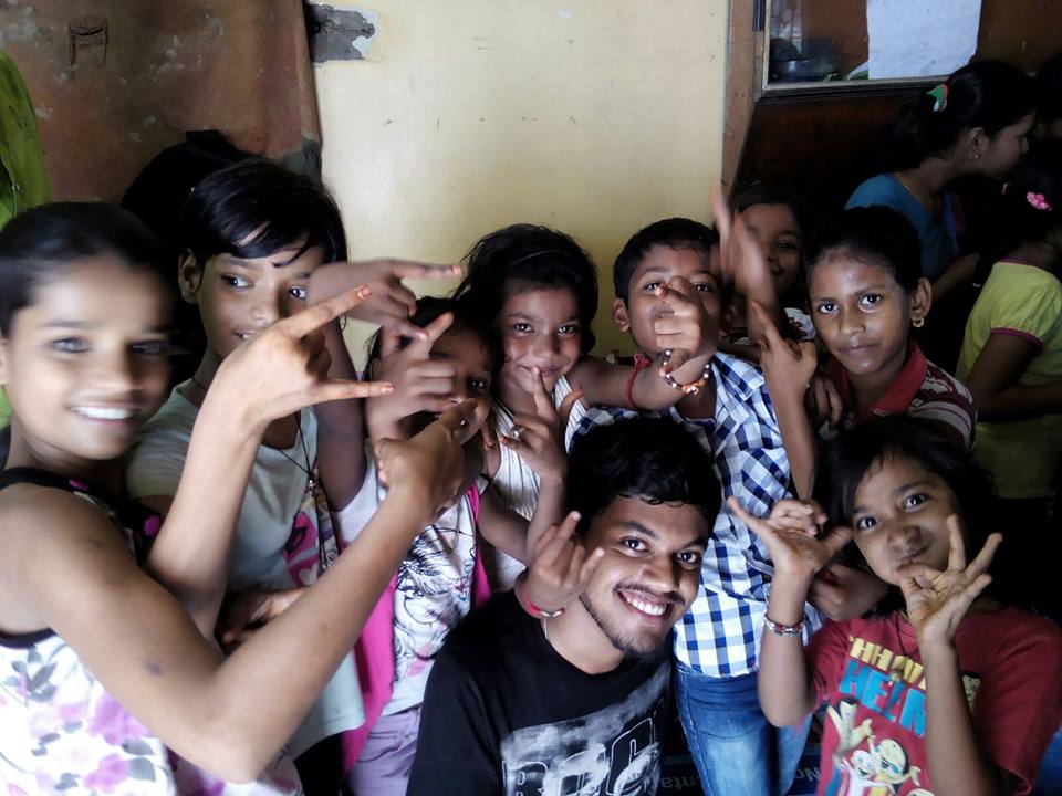 children with the volunteer after one of the sessions