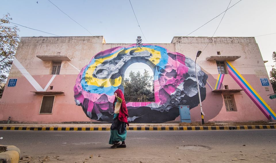 "The astronaut atop the wall is a metaphor for someone who can see things from a different perspective, as a silent viewer of a larger picture. In this case, he is a witness to all the daily activities of Lodhi colony."