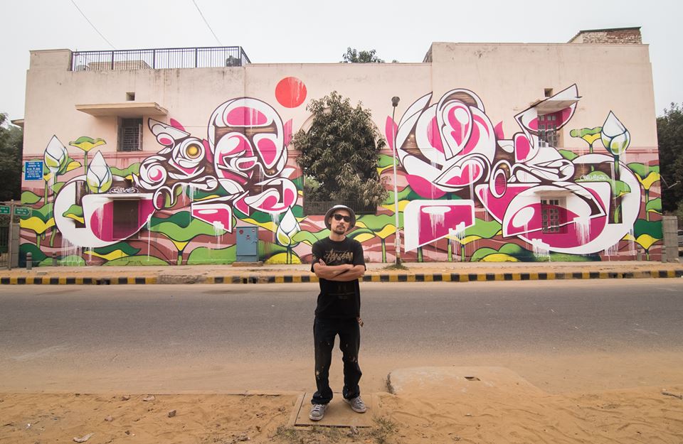 "The Lotus' by Suiko. In this piece Suiko takes the national flower of India - the lotus and re-imagines it with his signature of curved lines and Japanese characters to create this mural for the Lodhi Art District."