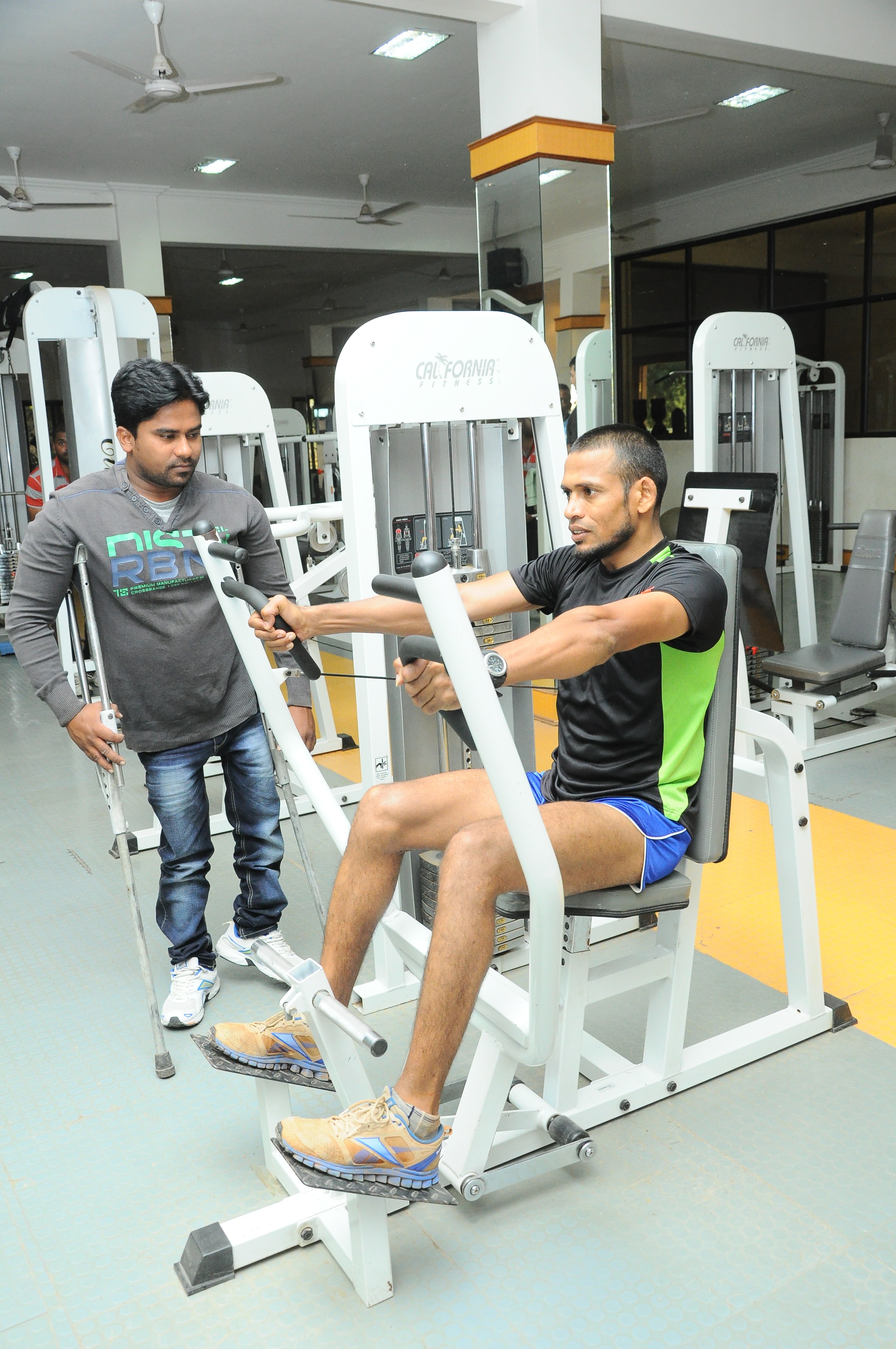 Kishore overseeing another of his pupil's training