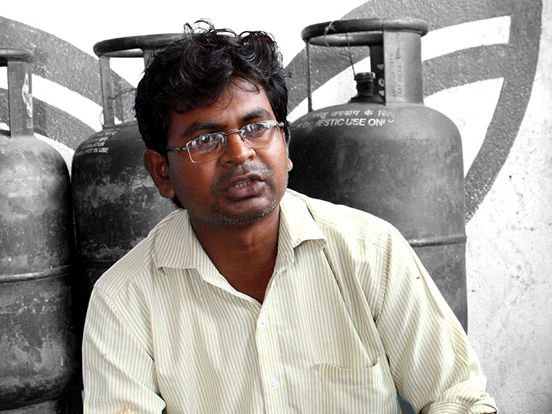 Rajendra Verma runs a cooking gas distribution agency in Birni. Photo: Vimages