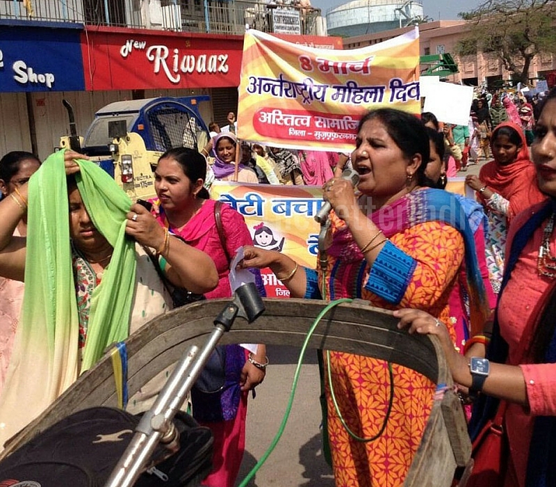 Addressing a rally on Women's Day