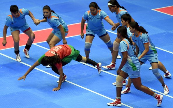 INCHEON, SOUTH KOREA - SEPTEMBER 28: Fatema Akhtar Poly of Bangladesh dives to evade India during the Kabaddi Womens Group Round match between India and Bangladesh during day nine of the 2014 Asian Games at Songdo Global University Gymnasium on September 28, 2014 in Incheon, South Korea. (Photo by Stanley Chou/Getty Images)