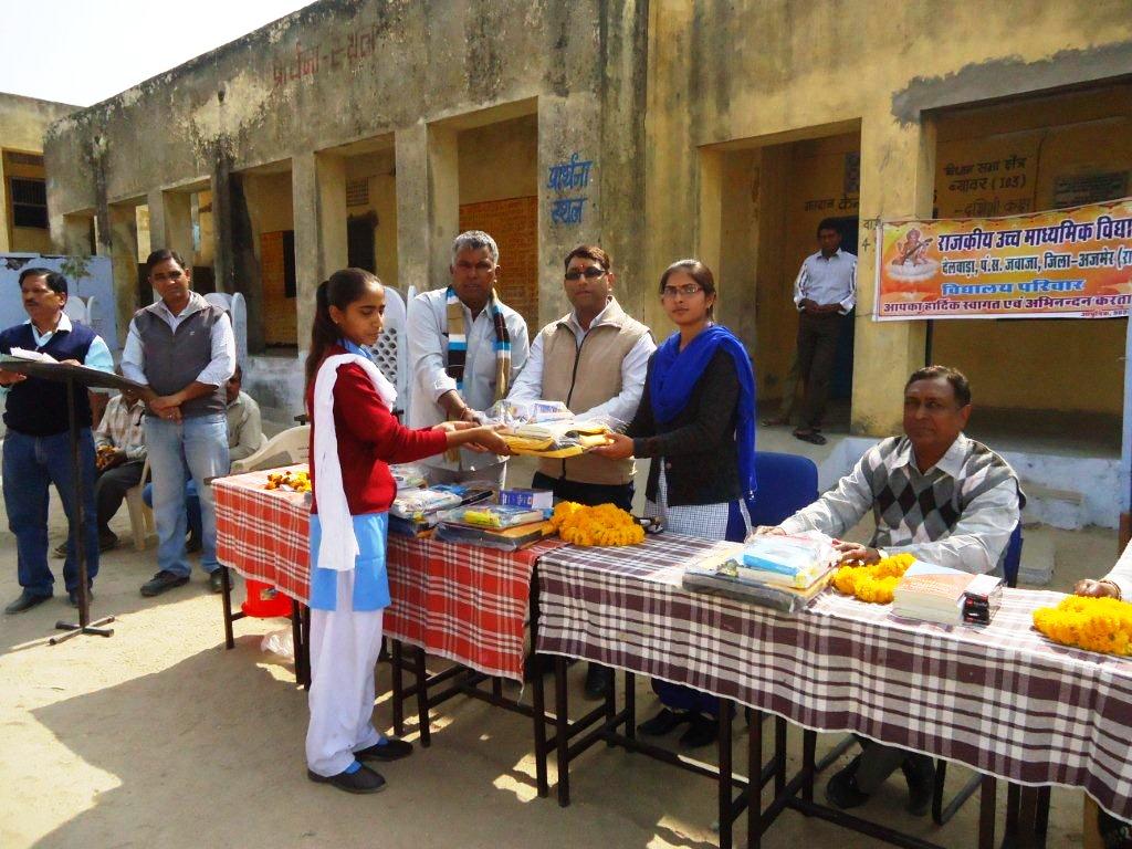 Kiran Kathat, the sarpanch of Delwara Gram Panchayat felicitates meritorious girls in Lasaria village.