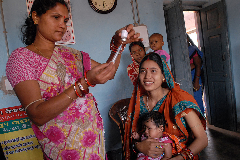 1024px-Community_health_worker_gives_a_vaccination_in_Odisha_state,_India_(8380317750)