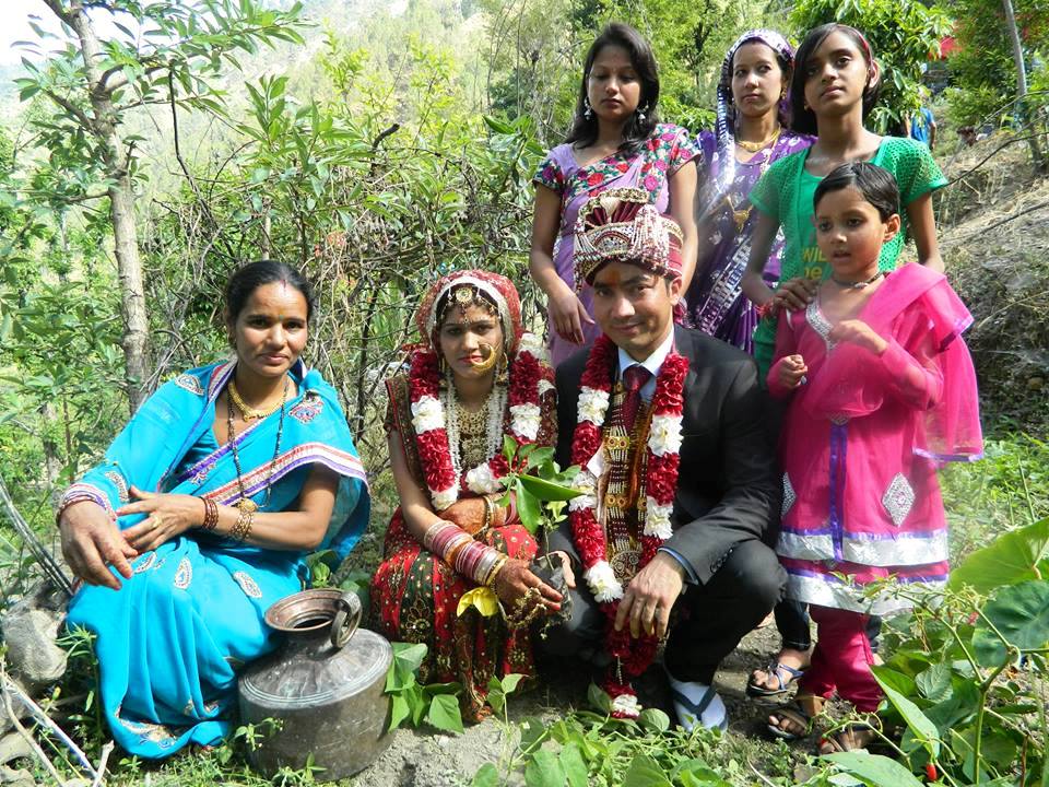  Amidst much fanfare a couple plants a sapling after their marriage ceremony.