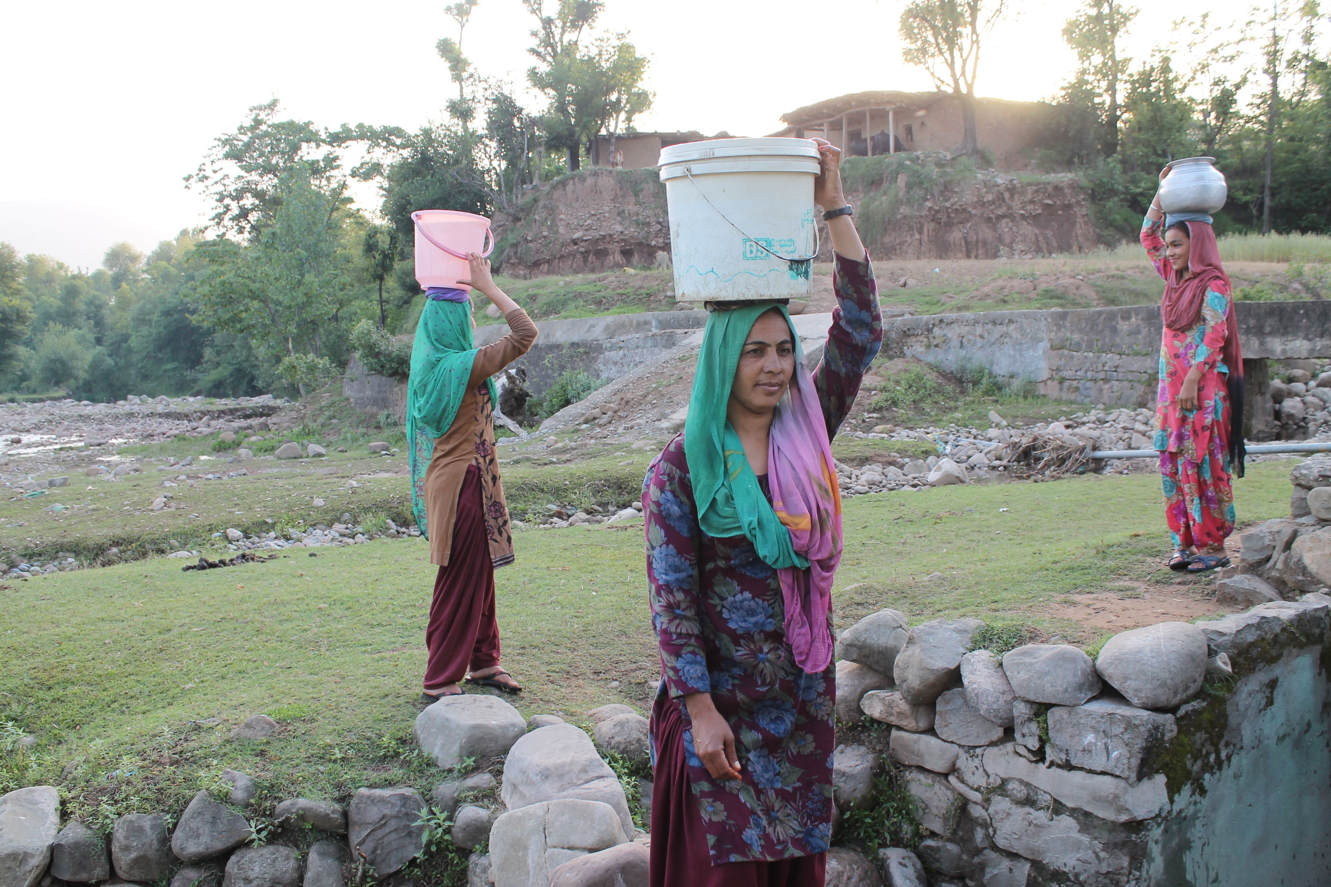 Carrying heavy loads of water on treacherous mountain paths is dangerous for women. 