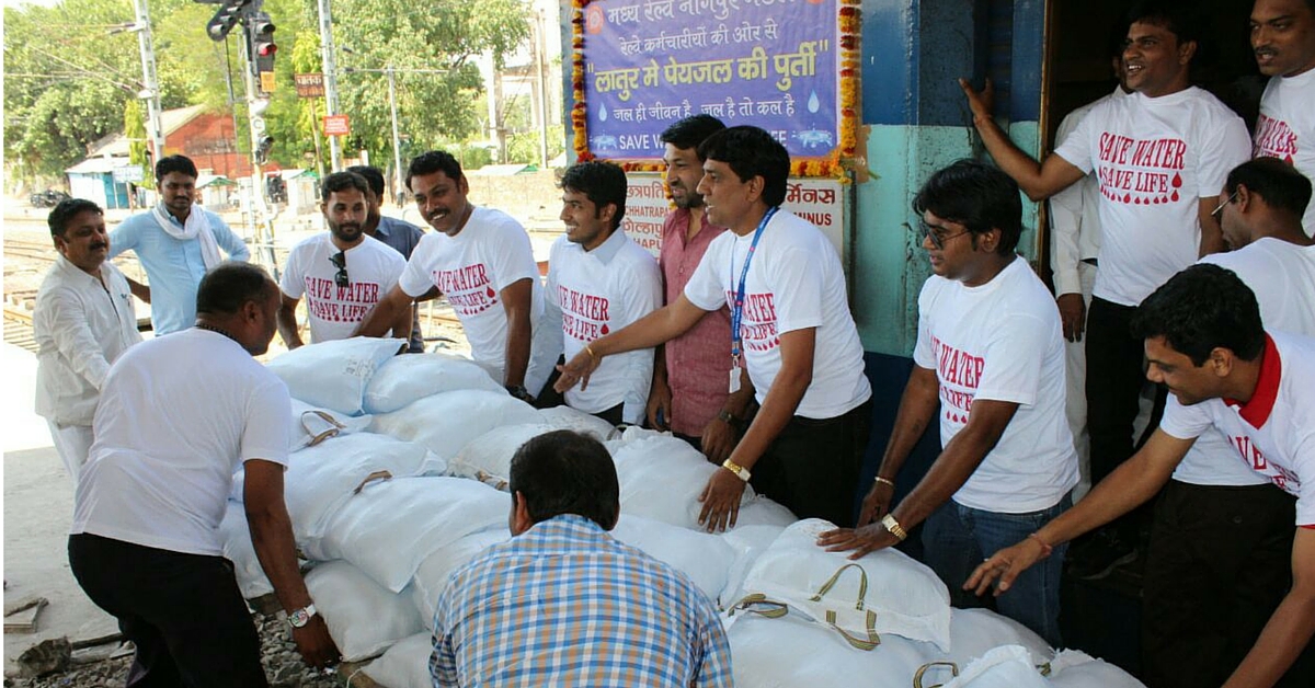 Employees of Central Railway from Nagpur transporting bags containing water pouches in Nagpur-Kolhapur Express