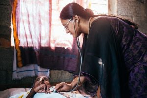 A doctor with Pallium India on a home visit