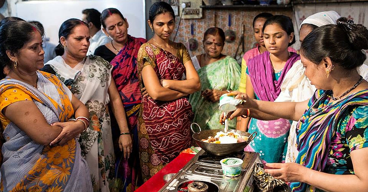 Rizwana Qureishi, one of the cooks in the book, showing the group how to make her wicked marinade for Chicken Biryani.