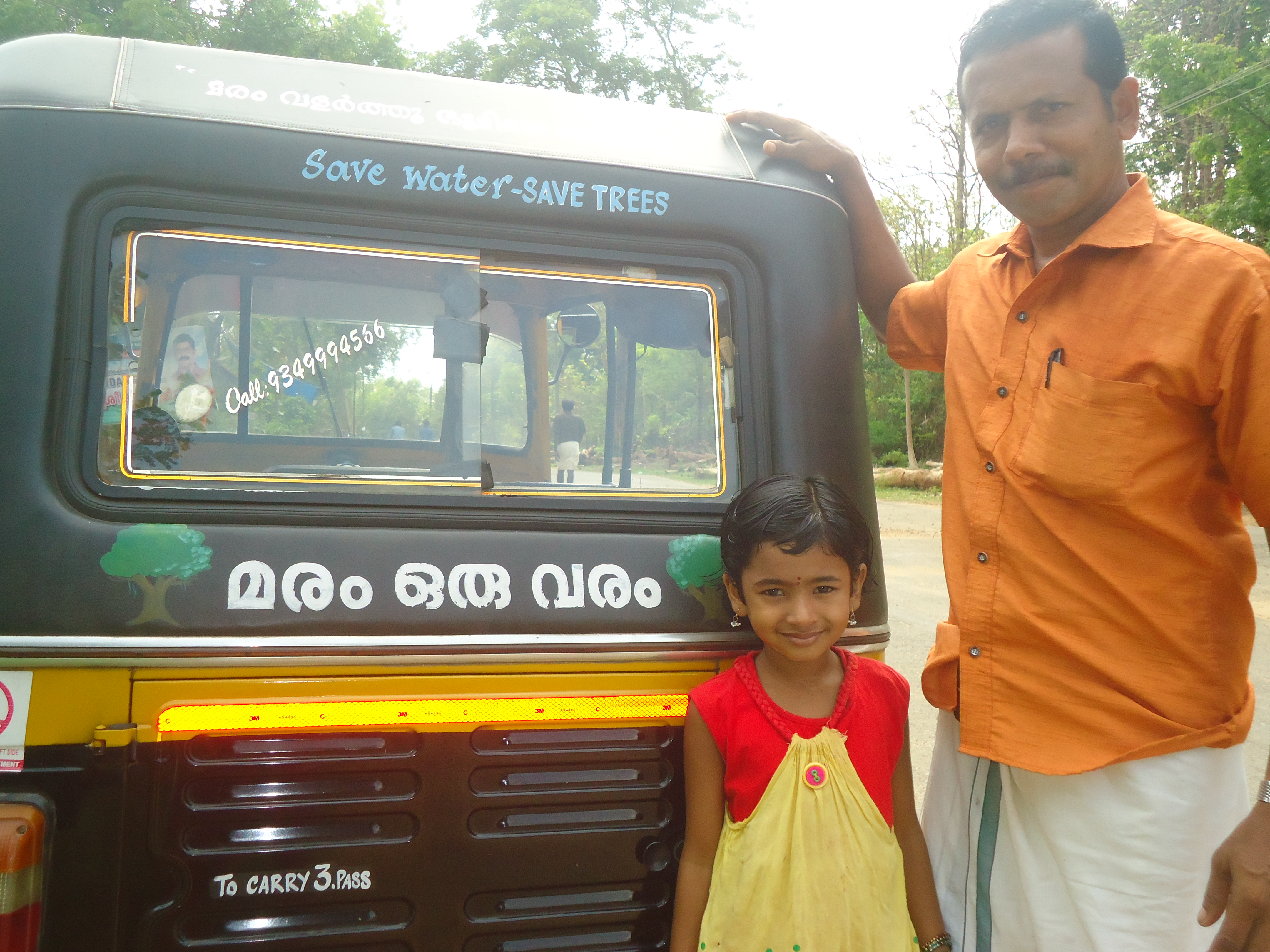 With his daughter and their vehicle