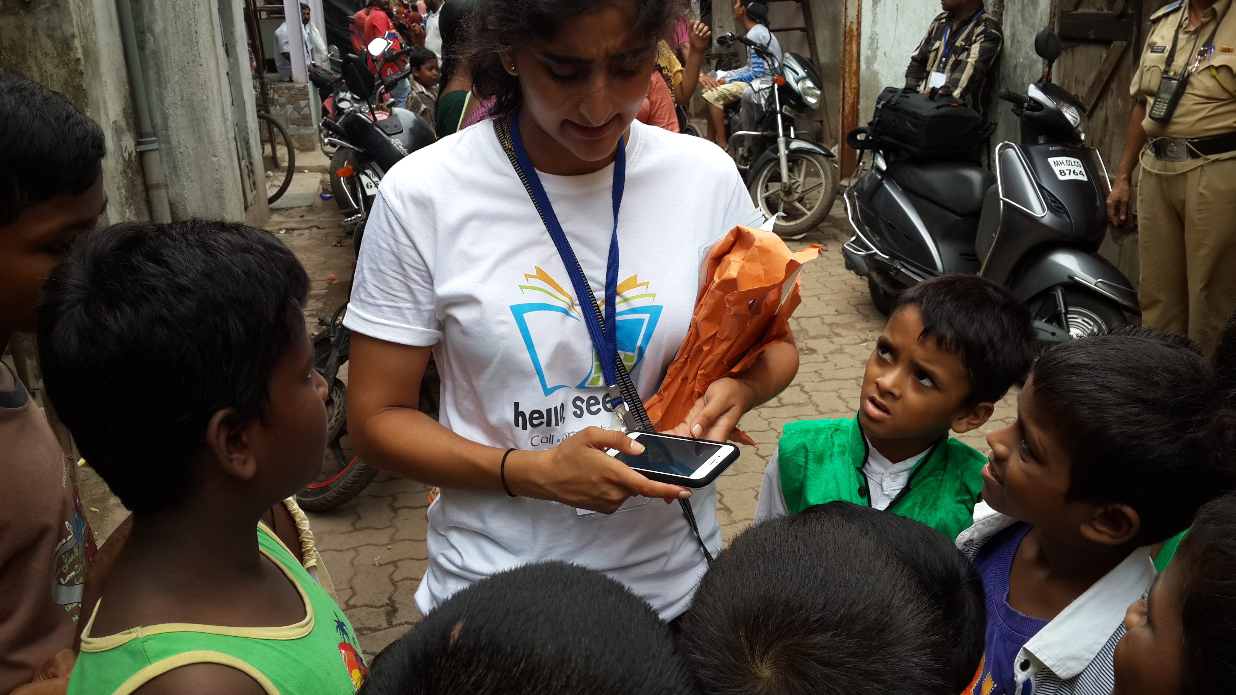Kasturi distributing flyers in Dharavi. July 2015.